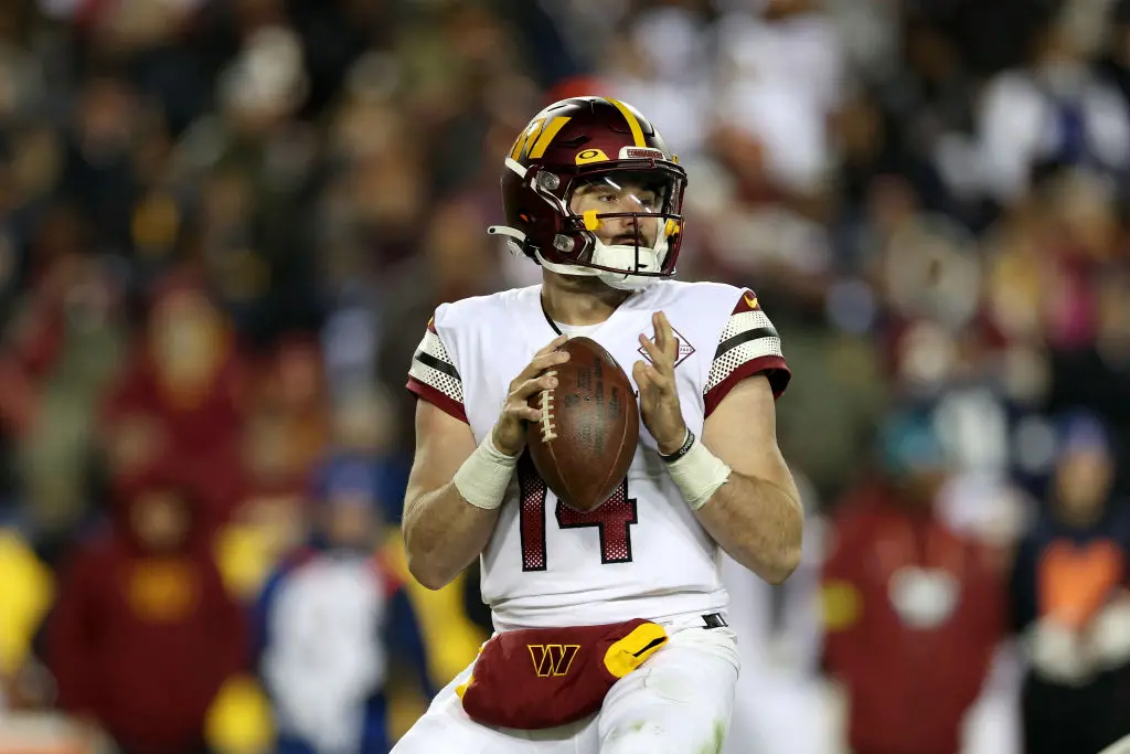 LANDOVER, MARYLAND - JANUARY 08: Quarterback Sam Howell #14 of the Washington Commanders drops back to pass against the Dallas Cowboys at FedExField on January 08, 2023 in Landover, Maryland