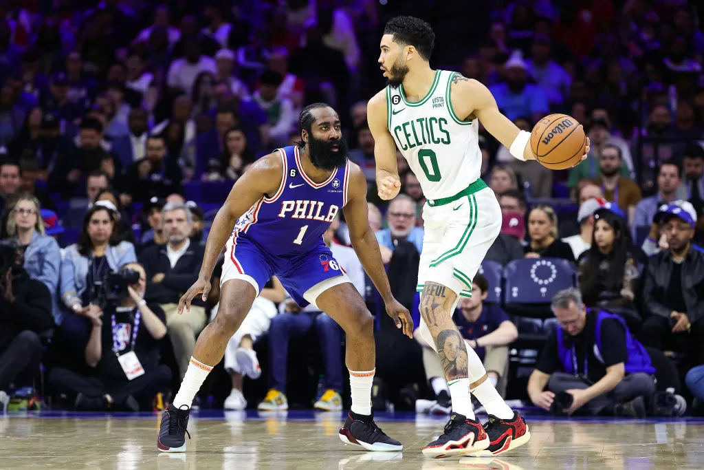 PHILADELPHIA, PENNSYLVANIA - APRIL 04: James Harden #1 of the Philadelphia 76ers guards Jayson Tatum #0 of the Boston Celtics during the second quarter at Wells Fargo Center on April 04, 2023 in Philadelphia, Pennsylvania