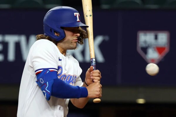 ARLINGTON, TEXAS - APRIL 03: An open cut is seen on the cheek of Josh Smith #47 of the Texas Rangers after being hit by a pitch from Danny Coulombe of the Baltimore Orioles in the third inning at Globe Life Field on April 03, 2023 in Arlington, Texas.