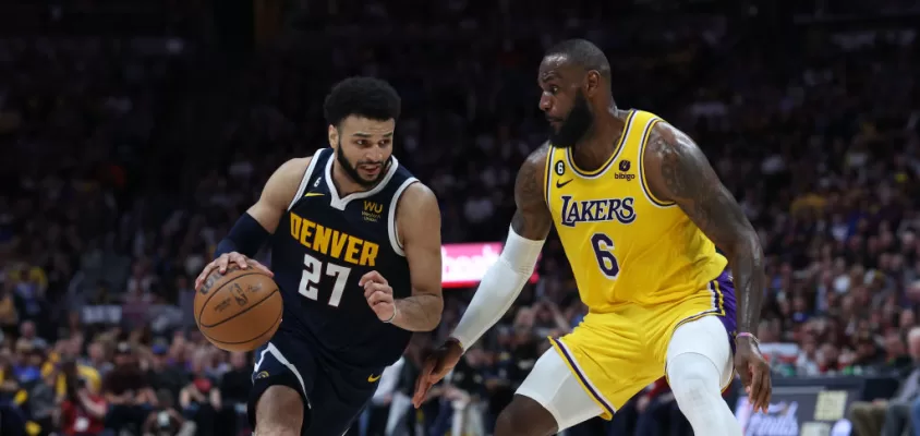 DENVER, COLORADO - MAY 18: Jamal Murray #27 of the Denver Nuggets drives against LeBron James #6 of the Los Angeles Lakers during the third quarter in game two of the Western Conference Finals at Ball Arena on May 18, 2023 in Denver, Colorado.