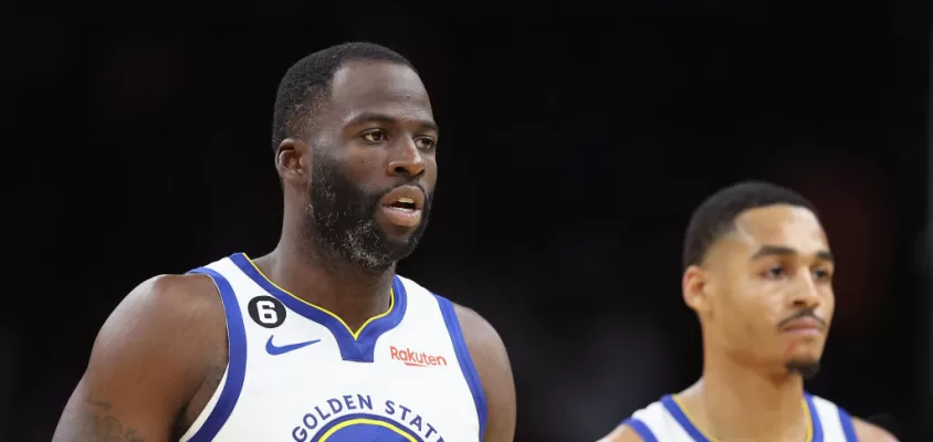 PHOENIX, ARIZONA - OCTOBER 25: (L-R) Draymond Green #23 and Jordan Poole #3 of the Golden State Warriors walk to the bench during the second half of the NBA game against the Phoenix Suns at Footprint Center on October 25, 2022 in Phoenix, Arizona. The Suns defeated the Warriors 134-105.