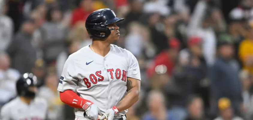 SAN DIEGO, CA - MAY 19: Rafael Devers #11 of the Boston Red Sox hits a three-run home run during the third inning of a baseball game against the San Diego Padres at Petco Park on May 19, 2023 in San Diego, California