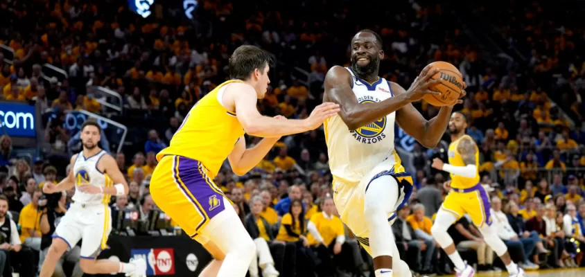 SAN FRANCISCO, CALIFORNIA - MAY 10: Draymond Green #23 of the Golden State Warriors drives to the basket against Austin Reaves #15 of the Los Angeles Lakers during the third quarter in game five of the Western Conference Semifinal Playoffs at Chase Center on May 10, 2023 in San Francisco, California.