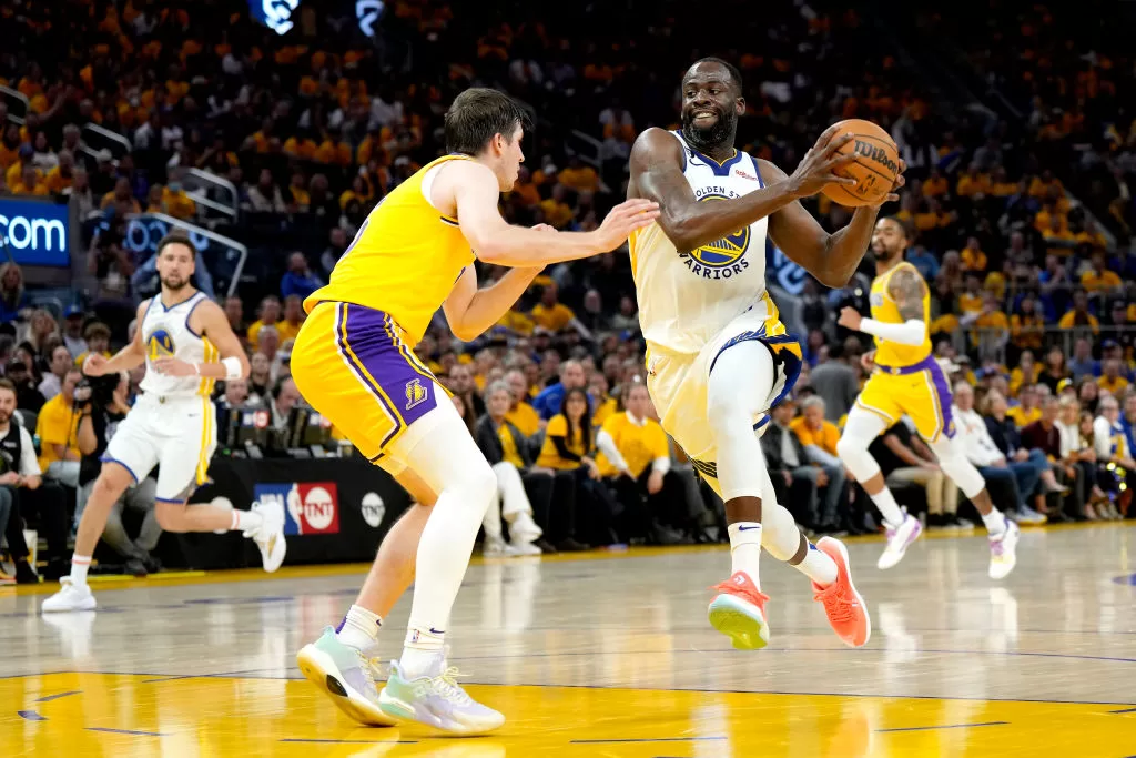 SAN FRANCISCO, CALIFORNIA - MAY 10: Draymond Green #23 of the Golden State Warriors drives to the basket against Austin Reaves #15 of the Los Angeles Lakers during the third quarter in game five of the Western Conference Semifinal Playoffs at Chase Center on May 10, 2023 in San Francisco, California.