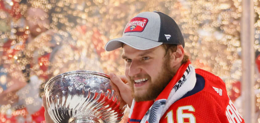 SUNRISE, FLORIDA - JUNE 24: Aleksander Barkov #16 of the Florida Panthers celebrates with the Stanley Cup following a 2-1 victory over the Edmonton Oilers in Game Seven of the 2024 NHL Stanley Cup Final at Amerant Bank Arena on June 24, 2024 in Sunrise, Florida