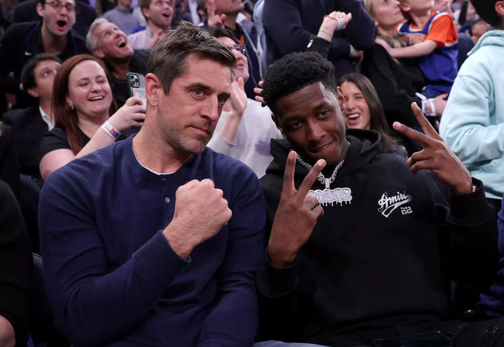 NEW YORK, NEW YORK - MAY 02: New York Jets quarterback Aaron Rodgers and cornerback Sauce Gardner attend game two of the Eastern Conference Semifinals between the New York Knicks and the Miami Heat at Madison Square Garden on May 02, 2023 in New York City. The New York Knicks defeated the Miami Heat 111-105.