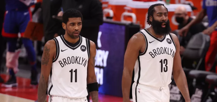 DETROIT, MICHIGAN - FEBRUARY 09: Kyrie Irving #11 and James Harden #13 of the Brooklyn Nets while playing the Detroit Pistons at Little Caesars Arena on February 09, 2021 in Detroit, Michigan.