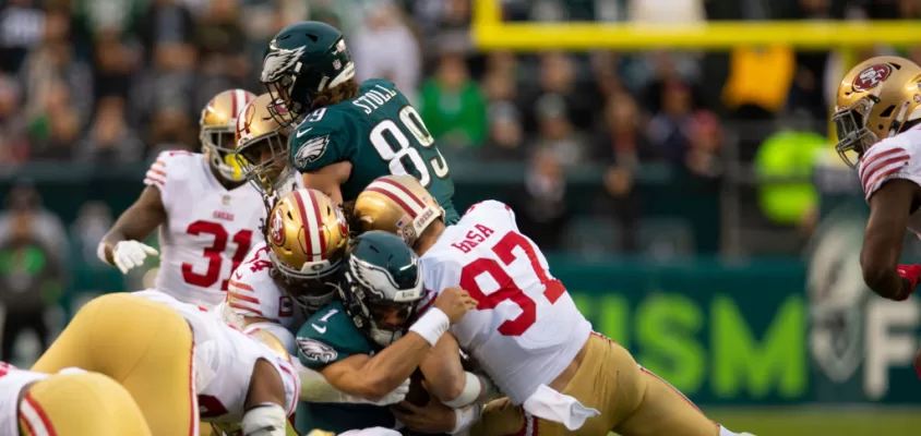 PHILADELPHIA, PA - JANUARY 29: Fred Warner #54 and Nick Bosa #97 of the San Francisco 49ers tackle Jalen Hurts #1 of the Philadelphia Eagles during the NFC Championship playoff game at Lincoln Financial Field on January 29, 2023 in Philadelphia, Pennsylvania. The Eagles defeated the 49ers 31-7.