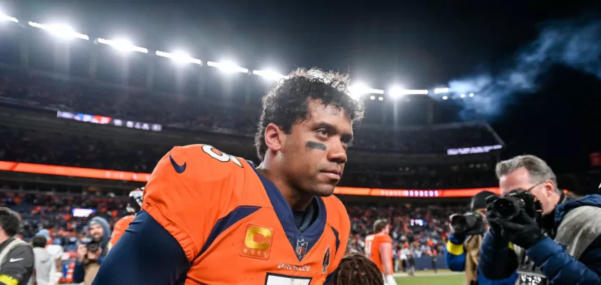 DENVER, CO - JANUARY 8: Denver Broncos quarterback Russell Wilson (3) on the field after a win against the Los Angeles Chargers after a game at Empower Field at Mile High on January 8, 2023 in Denver, Colorado