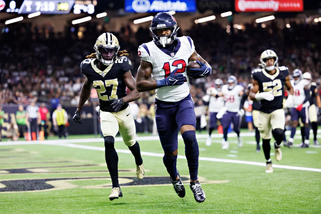 NEW ORLEANS, LOUISIANA - AUGUST 27: Nico Collins #12 of the Houston Texans catches a pass for a touchdown during the preseason game against the New Orleans Saints at Caesars Superdome on August 27, 2023 in New Orleans, Louisiana. 