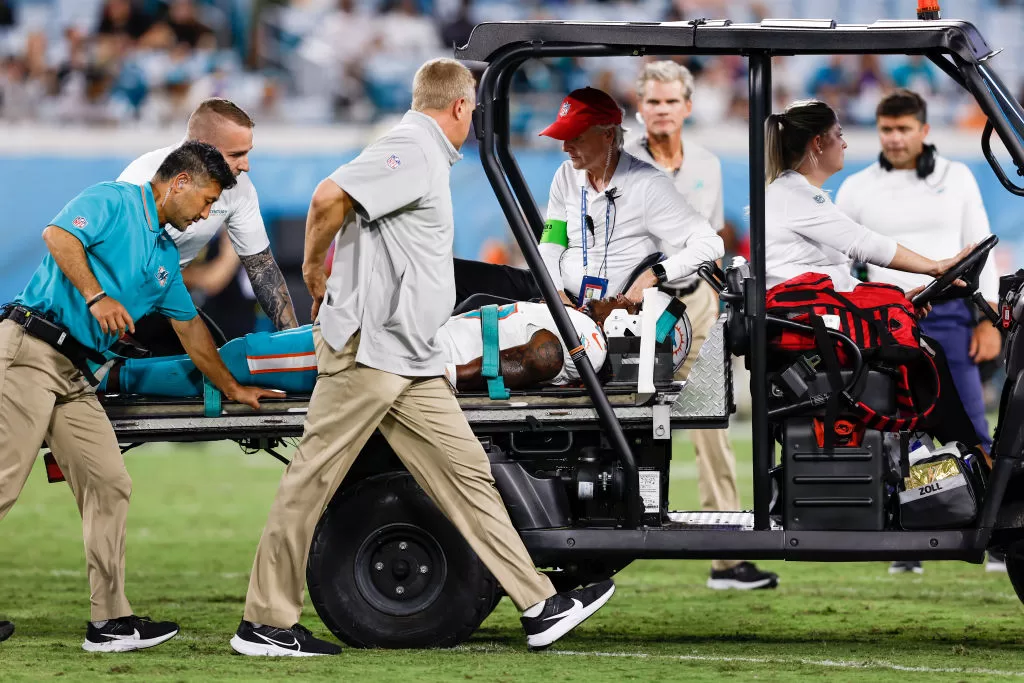 JACKSONVILLE, FL - AUGUST 26: Wide Receiver Daewood Davis of the Miami Dolphins is taken off the field on a cart after an injury during a preseason game against the Jacksonville Jaguars at TIAA Bank Field on January 26, 2023 in Jacksonville, Florida. The Jaguars defeated the Dolphins 31 to 18.