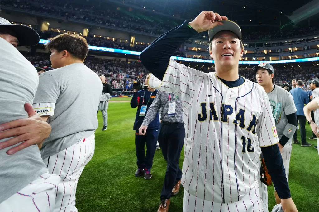 MIAMI, FL - MARCH 21: Shohei Ohtani #16 of Team Japan celebrates with teammates after a 3-2 victory over Team USA in the 2023 World Baseball Classic Championship game at loanDepot Park on Tuesday, March 21, 2023 in Miami, Florida