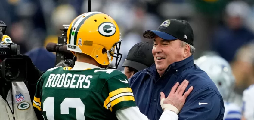 GREEN BAY, WISCONSIN - NOVEMBER 13: Aaron Rodgers #12 of the Green Bay Packers talks to head coach Mike McCarthy of the Dallas Cowboys during pregame at Lambeau Field on November 13, 2022 in Green Bay, Wisconsin.