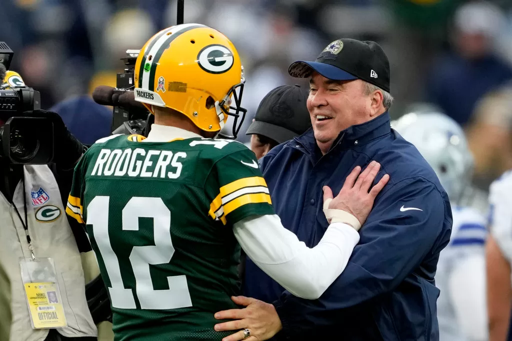 GREEN BAY, WISCONSIN - NOVEMBER 13: Aaron Rodgers #12 of the Green Bay Packers talks to head coach Mike McCarthy of the Dallas Cowboys during pregame at Lambeau Field on November 13, 2022 in Green Bay, Wisconsin.