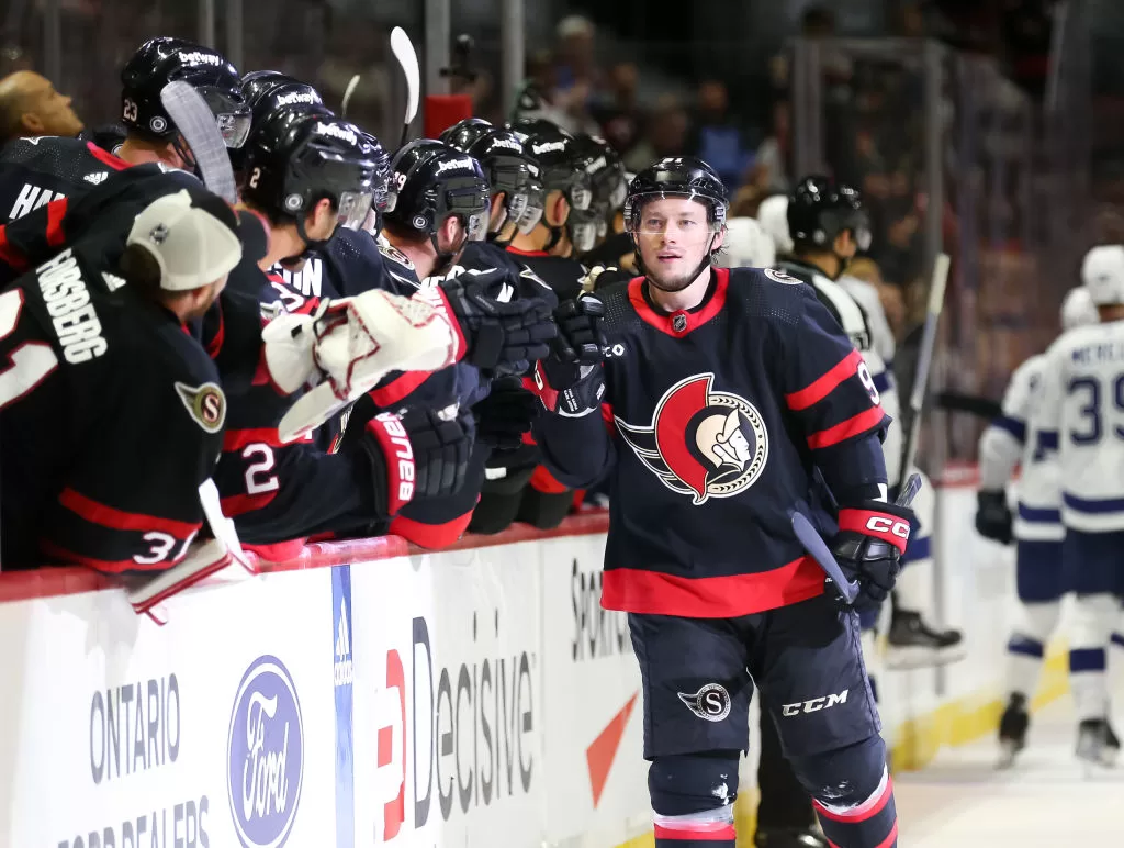 OTTAWA, CANADA - OCTOBER 15: Vladimir Tarasenko #91 of the Ottawa Senators celebrates his first period goal against the Tampa Bay Lightning with his teammates on the bench at Canadian Tire Centre on October 15, 2023 in Ottawa, Ontario, Canada