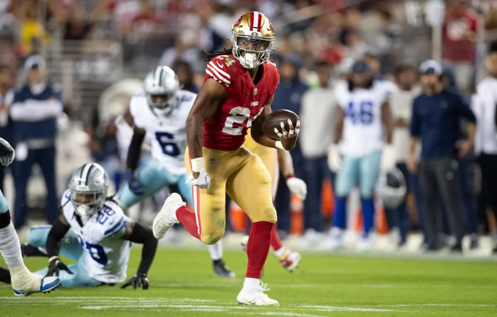 SANTA CLARA, CA - OCTOBER 8: Jordan Mason #24 of the San Francisco 49ers rushes for a 26-yard touchdown during game against the Dallas Cowboys at Levi's Stadium on October 8, 2023 in Santa Clara, California. The 49ers defeated the Cowboys 42-10.