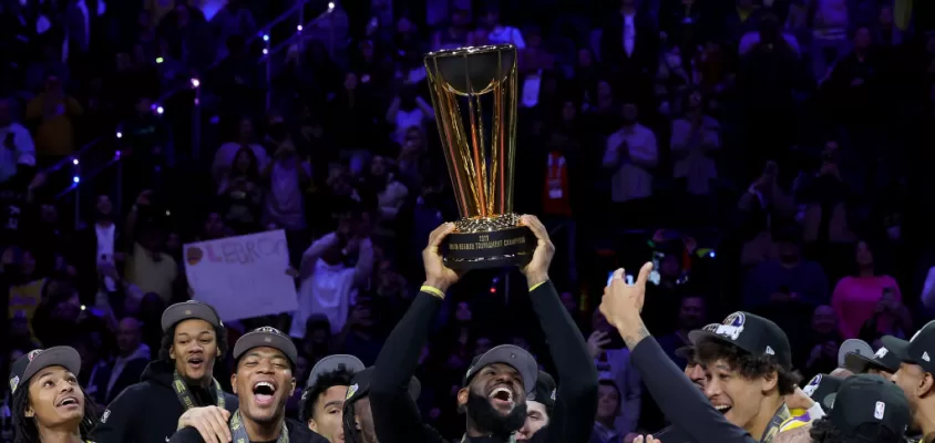 LAS VEGAS, NEVADA - DECEMBER 09: LeBron James #23 of the Los Angeles Lakers hoists the trophy with his teammates after winning the championship game of the inaugural NBA In-Season Tournament at T-Mobile Arena on December 09, 2023 in Las Vegas, Nevada.