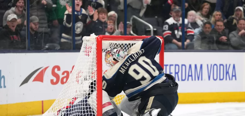 COLUMBUS, OH - DECEMBER 21: Elvis Merzlikins #90 of the Columbus Blue Jackets fights Tom Wilson #43 of the Washington Capitals in a goal during overtime at Nationwide Arena in Columbus, Ohio on December 21, 2023.