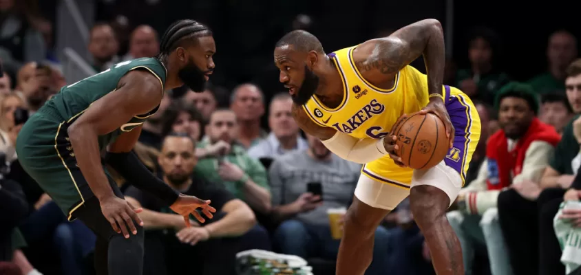 BOSTON, MASSACHUSETTS - JANUARY 28: Jaylen Brown #7 of the Boston Celtics defends LeBron James #6 of the Los Angeles Lakers during the first half at TD Garden on January 28, 2023 in Boston, Massachusetts.