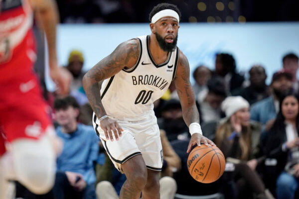 WASHINGTON, DC - DECEMBER 29: Royce O'Neale #00 of the Brooklyn Nets dribbles the ball during the second half against the Washington Wizards at Capital One Arena on December 29, 2023 in Washington, DC.