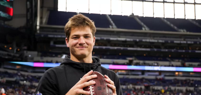 INDIANAPOLIS, INDIANA - MARCH 2: Drake Maye #QB04 of North Carolina holds a football during the NFL Scouting Combine at Lucas Oil Stadium on March 2, 2024 in Indianapolis, Indiana