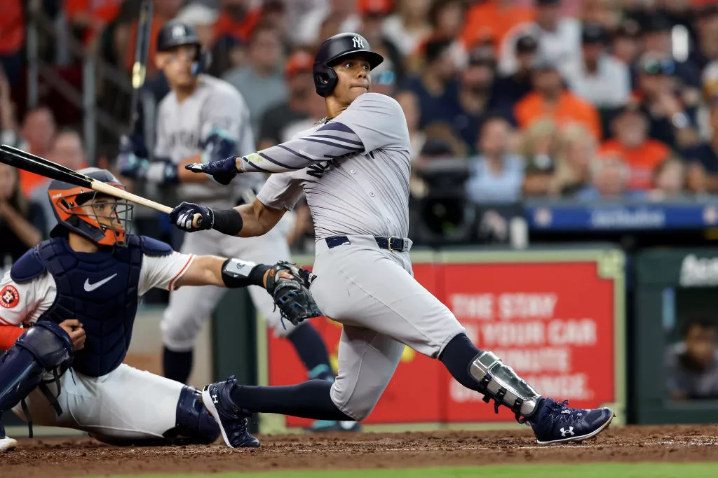 HOUSTON, TEXAS - MARCH 28: Juan Soto #22 of the New York Yankees hits an RBI single in the fifth inning against the Houston Astros on Opening Day at Minute Maid Park on March 28, 2024 in Houston, Texas.