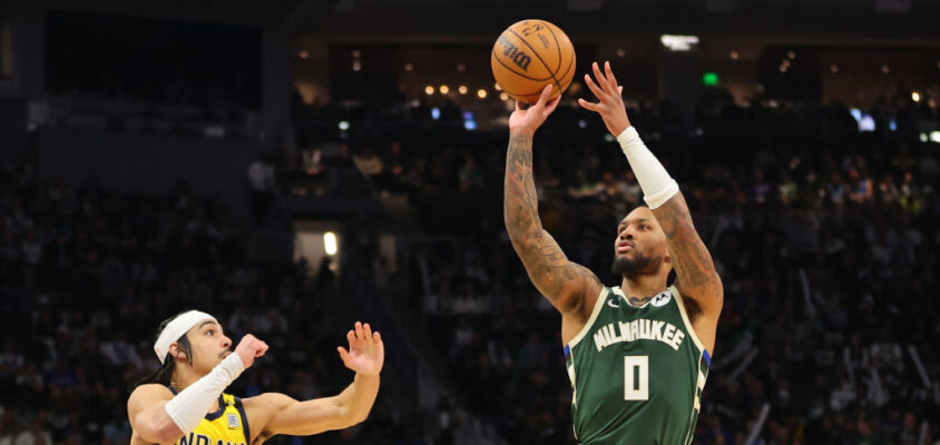 MILWAUKEE, WISCONSIN - APRIL 21: Damian Lillard #0 of the Milwaukee Bucks shoots over Andrew Nembhard #2 of the Indiana Pacers during the second half of game one of the Eastern Conference First Round Playoffs at Fiserv Forum on April 21, 2024 in Milwaukee, Wisconsin.