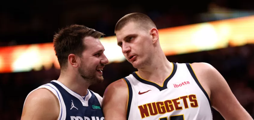 DALLAS, TX - MARCH 17: Luka Doncic #77 of the Dallas Mavericks and Nikola Jokic #15 of the Denver Nuggets talk during a beak in the action in the second half at American Airlines Center on March 17, 2024 in Dallas, Texas.