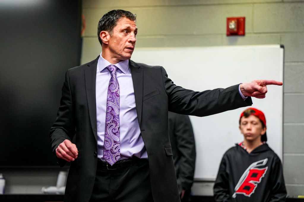 RALEIGH, NORTH CAROLINA - MARCH 21: Carolina Hurricanes head coach Rod Brind'Amour talks in the locker room after an NHL hockey game against the Philadelphia Flyers at PNC Arena on March 21, 2024 in Raleigh, North Carolina.