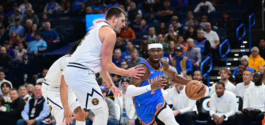 OKLAHOMA CITY, OKLAHOMA - OCTOBER 29: Shai Gilgeous-Alexander #2 of the Oklahoma City Thunder attempts to drive past Nikola Jokic #15 of the Denver Nuggets during the first quarter of a game at Paycom Center on October 29, 2023 in Oklahoma City, Oklahoma.