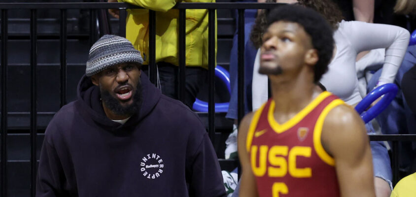 BERKELEY, CALIFORNIA - FEBRUARY 07: LeBron James #23 of the Los Angeles Lakers shouts to his son, Bronny James #6 of the USC Trojans, during Bronny's game against the California Golden Bears at Haas Pavilion on February 07, 2024 in Berkeley, California.