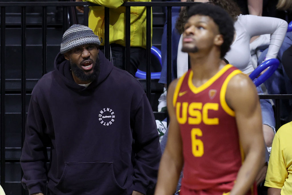 BERKELEY, CALIFORNIA - FEBRUARY 07: LeBron James #23 of the Los Angeles Lakers shouts to his son, Bronny James #6 of the USC Trojans, during Bronny's game against the California Golden Bears at Haas Pavilion on February 07, 2024 in Berkeley, California.