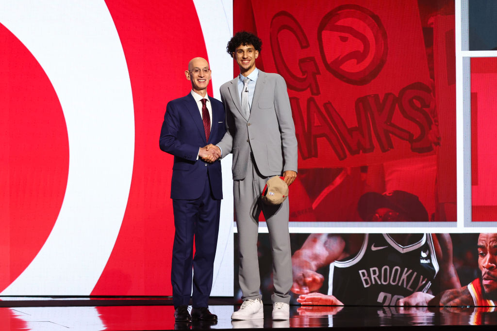 NEW YORK, NEW YORK - JUNE 26: Zaccharie Risacher (R) Shakes hands with NBA commissioner Adam Silver (L) after being drafted first overall pick by the Atlanta Hawks during the first round of the 2024 NBA Draft at Barclays Center on June 26, 2024 in the Brooklyn borough of New York City.