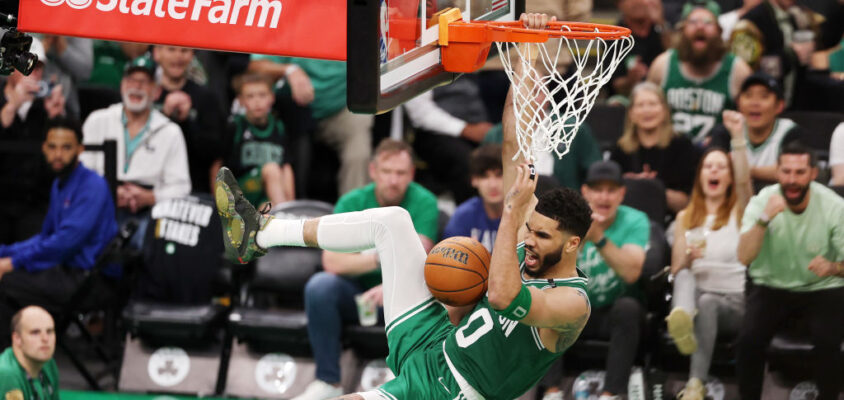 BOSTON, MASSACHUSETTS - JUNE 17: Jayson Tatum #0 of the Boston Celtics reacts after a dunk during the third quarter of Game Five of the 2024 NBA Finals against the Dallas Mavericks at TD Garden on June 17, 2024 in Boston, Massachusetts.