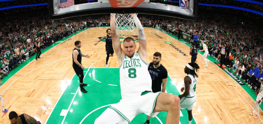 BOSTON, MASSACHUSETTS - JUNE 06: Kristaps Porzingis #8 of the Boston Celtics dunks the ball during the first quarter against the Dallas Mavericks in Game One of the 2024 NBA Finals at TD Garden on June 06, 2024 in Boston, Massachusetts.