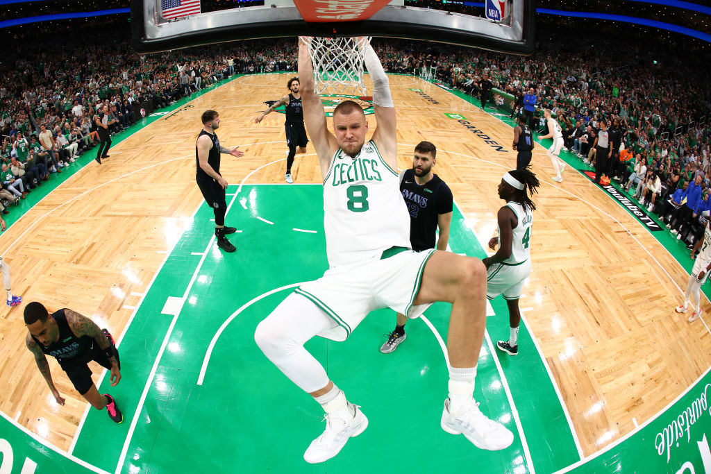 BOSTON, MASSACHUSETTS - JUNE 06: Kristaps Porzingis #8 of the Boston Celtics dunks the ball during the first quarter against the Dallas Mavericks in Game One of the 2024 NBA Finals at TD Garden on June 06, 2024 in Boston, Massachusetts.