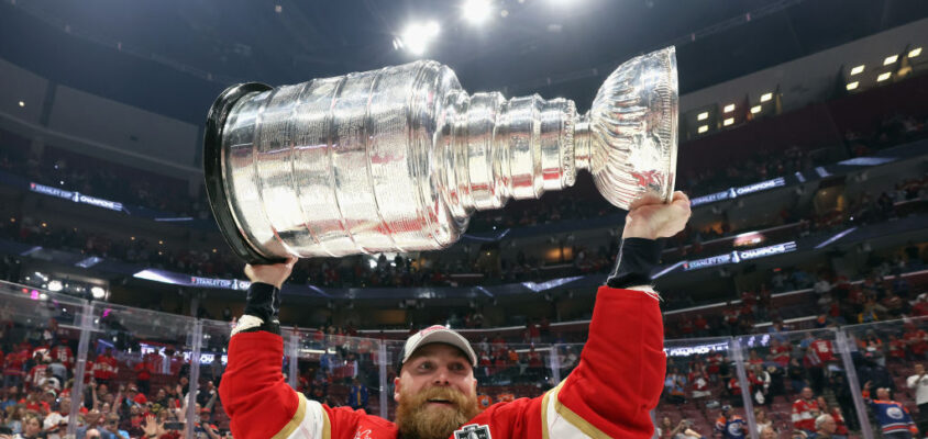 SUNRISE, FLORIDA - JUNE 24: Sam Bennett #9 of the Florida Panthers celebrates with the Stanley Cup following a 2-1 victory over the Edmonton Oilers in Game Seven of the 2024 NHL Stanley Cup Final at Amerant Bank Arena on June 24, 2024 in Sunrise, Florida