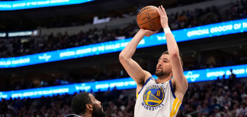 DALLAS, TEXAS - APRIL 05: Klay Thompson #11 of the Golden State Warriors shoots the ball against Kyrie Irving #11 of the Dallas Mavericks during the second half at American Airlines Center on April 05, 2024 in Dallas, Texas. NOTE TO USER: User expressly acknowledges and agrees that, by downloading and or using this photograph, User is consenting to the terms and conditions of the Getty Images License Agreement.