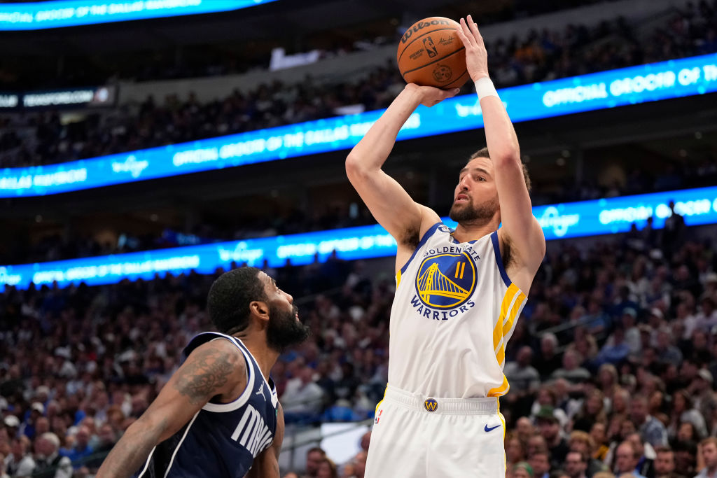 DALLAS, TEXAS - APRIL 05: Klay Thompson #11 of the Golden State Warriors shoots the ball against Kyrie Irving #11 of the Dallas Mavericks during the second half at American Airlines Center on April 05, 2024 in Dallas, Texas. NOTE TO USER: User expressly acknowledges and agrees that, by downloading and or using this photograph, User is consenting to the terms and conditions of the Getty Images License Agreement.