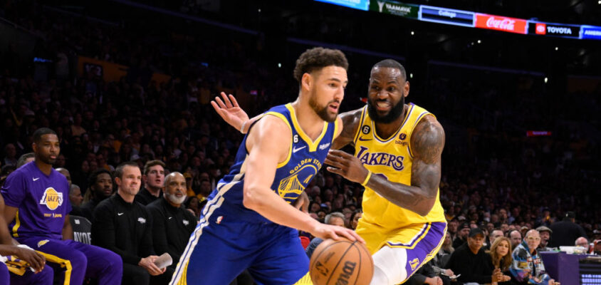 Los Angeles, CA - May 12: Klay Thompson #11 of the Golden State Warriors drives to the basket against LeBron James #6 of the Los Angeles Lakers in the first half of game 6 of a Western Conference Semifinals NBA playoff basketball game at the Crypto.com Arena in Los Angeles on Friday, May 12, 2023.