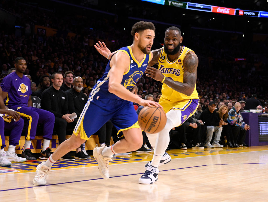 Los Angeles, CA - May 12: Klay Thompson #11 of the Golden State Warriors drives to the basket against LeBron James #6 of the Los Angeles Lakers in the first half of game 6 of a Western Conference Semifinals NBA playoff basketball game at the Crypto.com Arena in Los Angeles on Friday, May 12, 2023.