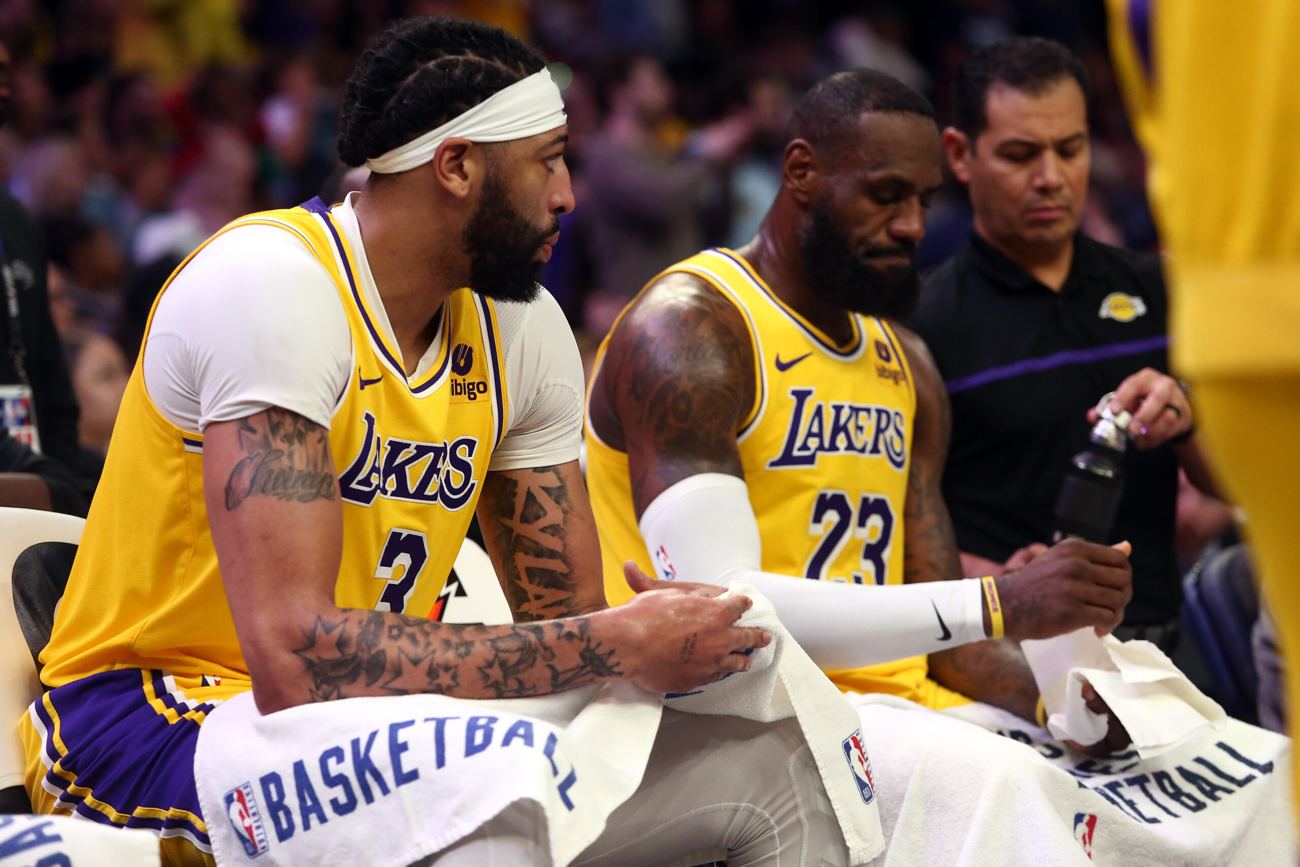 Apr 12, 2024; Memphis, Tennessee, USA; Los Angeles Lakers forward Anthony Davis (3) and forward LeBron James (23) sit on the bench during a time out during the second half against the Memphis Grizzlies at FedExForum. Mandatory Credit: Petre Thomas-USA TODAY Sports