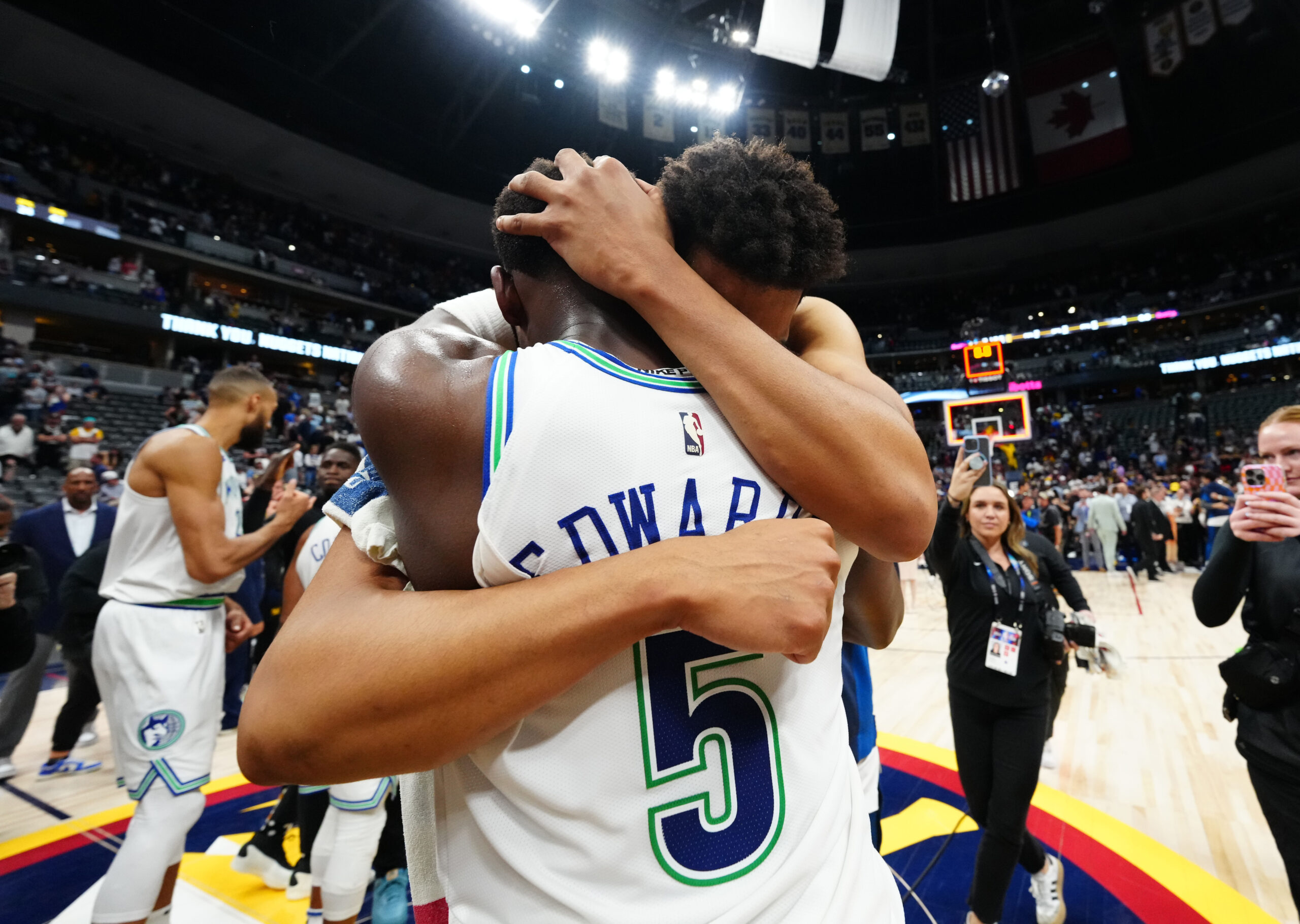 May 19, 2024; Denver, Colorado, USA; Minnesota Timberwolves center Karl-Anthony Towns (32) and guard Anthony Edwards (5) celebrate defeating the Denver Nuggets in game seven of the second round for the 2024 NBA playoffs at Ball Arena.