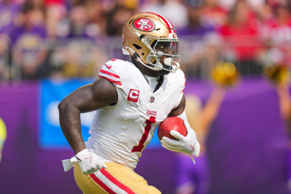 Sep 15, 2024; Minneapolis, Minnesota, USA; San Francisco 49ers wide receiver Deebo Samuel Sr. (1) runs back a kick against the Minnesota Vikings in the first quarter at U.S. Bank Stadium.