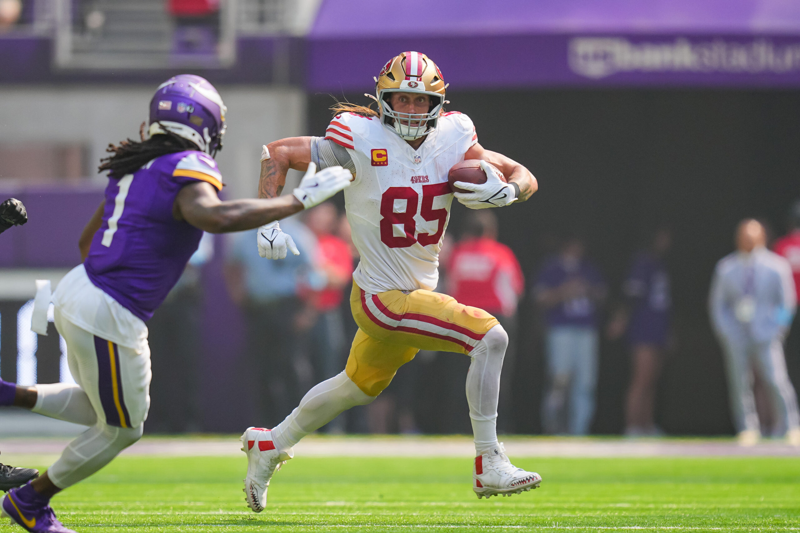 Sep 15, 2024; Minneapolis, Minnesota, USA; San Francisco 49ers tight end George Kittle (85) runs after the catch against the Minnesota Vikings in the second quarter at U.S. Bank Stadium. Mandatory Credit: Brad Rempel-Imagn Images