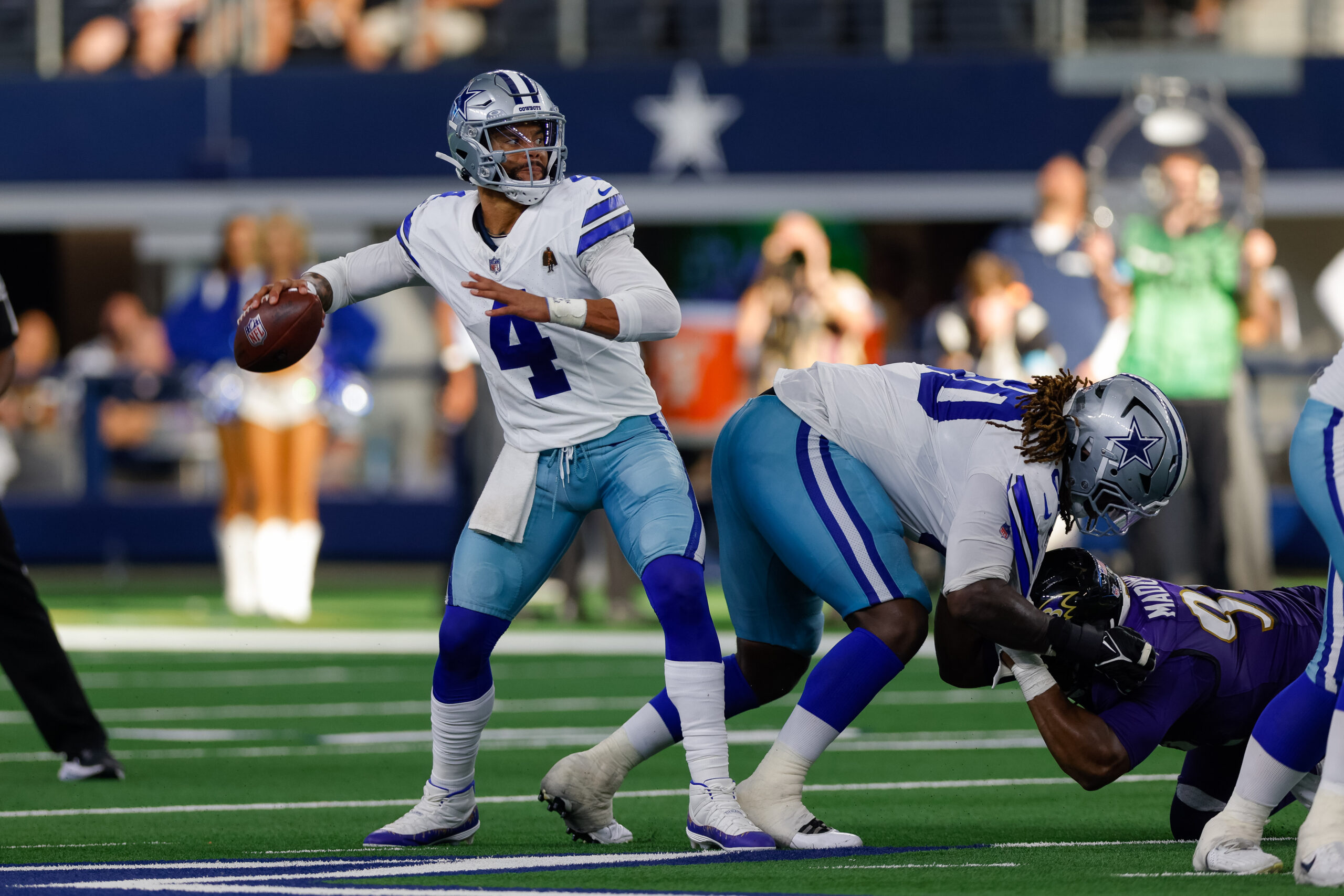 Sep 22, 2024; Arlington, Texas, USA; Dallas Cowboys quarterback Dak Prescott (4) drops back to pass during the fourth quarter against the Baltimore Ravens at AT&T Stadium. Mandatory Credit: Andrew Dieb-Imagn Images