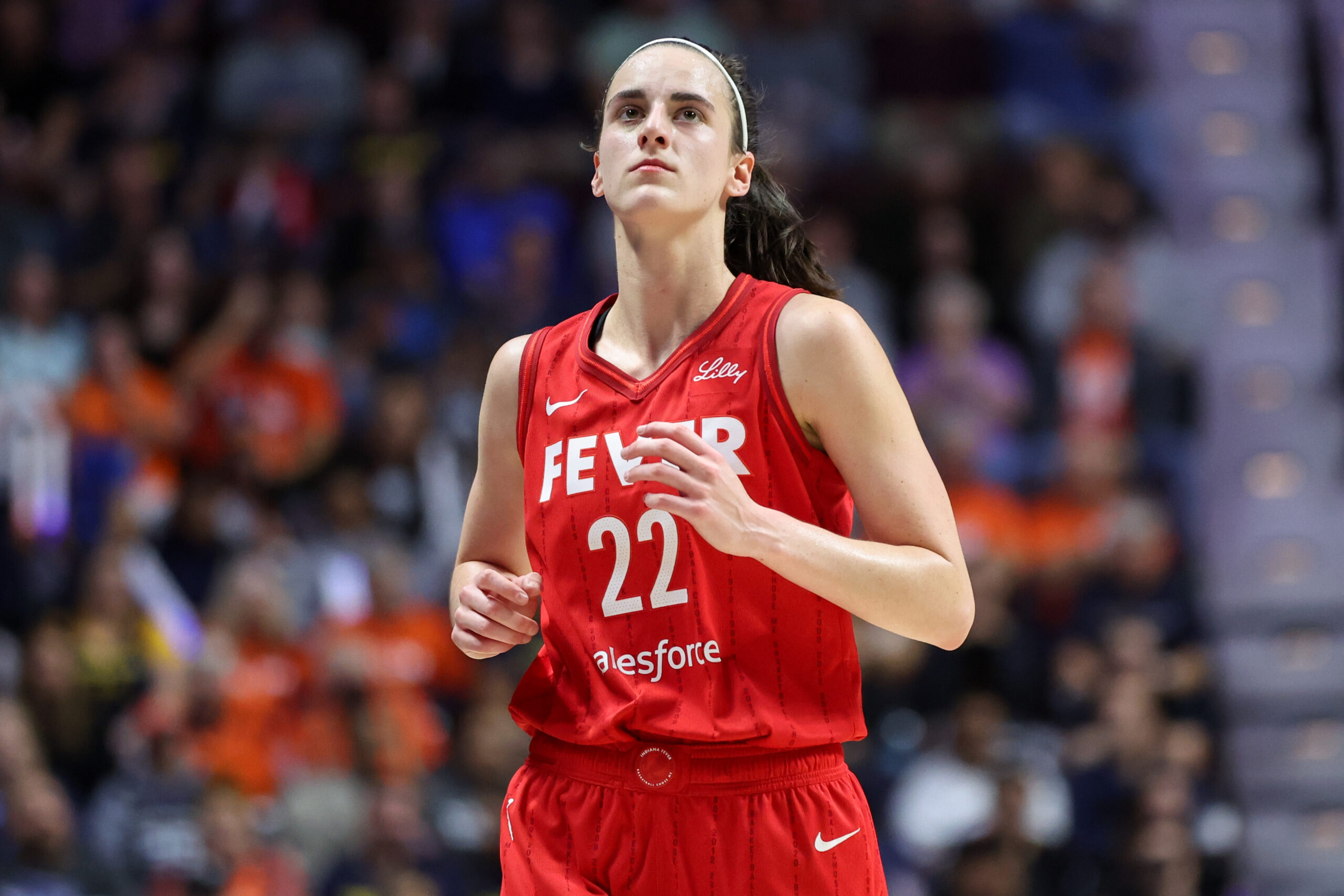 Sep 25, 2024; Uncasville, Connecticut, USA; Indiana Fever guard Caitlin Clark (22) reacts during the first half against the Connecticut Sun during game two of the first round of the 2024 WNBA Playoffs at Mohegan Sun Arena.