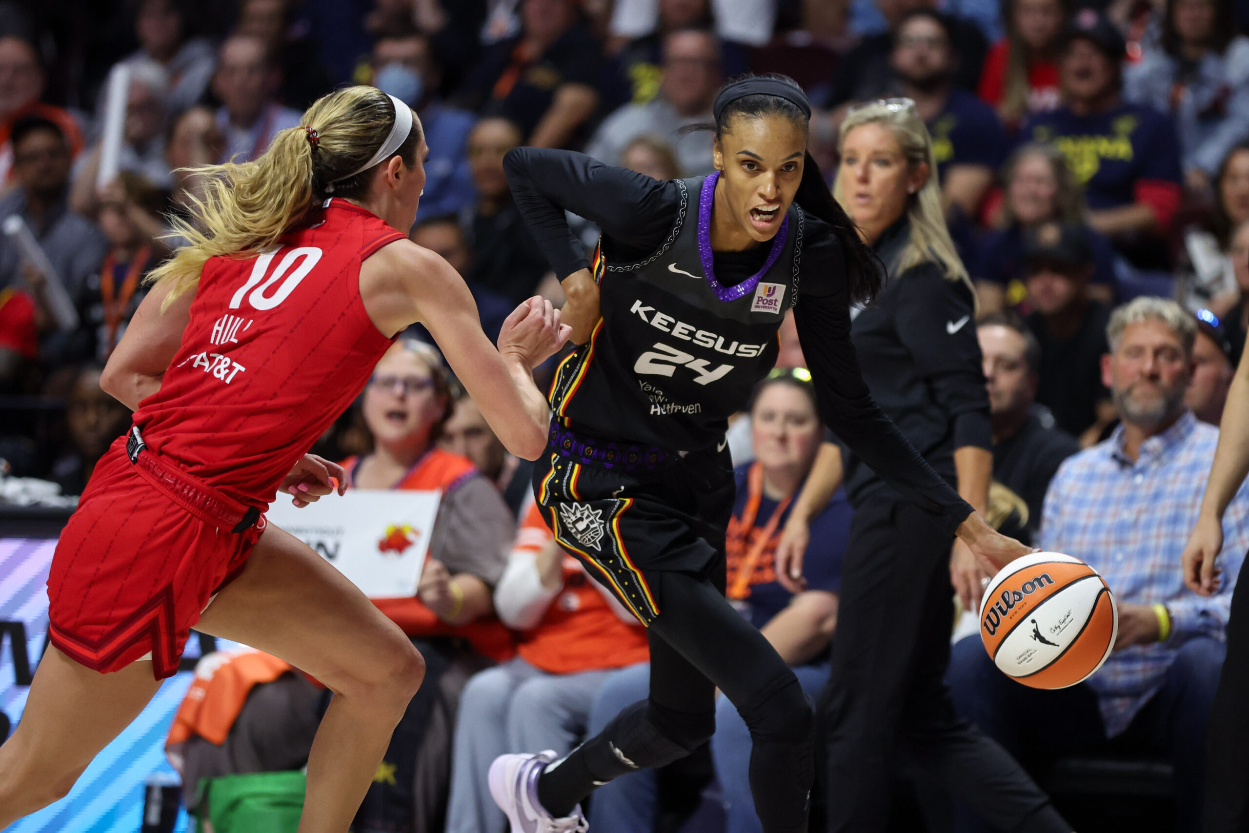 Sep 25, 2024; Uncasville, Connecticut, USA; Connecticut Sun guard DeWanna Bonner (24) drives to the basket defended by Indiana Fever guard Lexie Hull (10) during the second half during game two of the first round of the 2024 WNBA Playoffs at Mohegan Sun Arena.