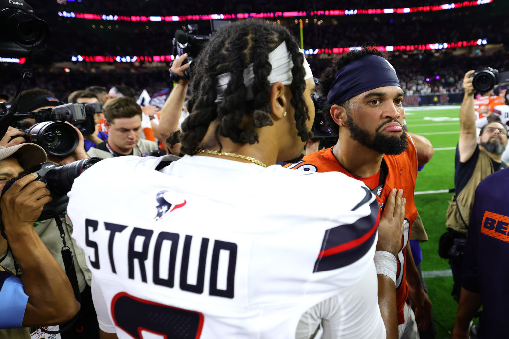 HOUSTON, TEXAS - SEPTEMBER 15: C.J. Stroud #7 of the Houston Texans shakes hands with Caleb Williams #18 of the Chicago Bears following the game at NRG Stadium on September 15, 2024 in Houston, Texas.