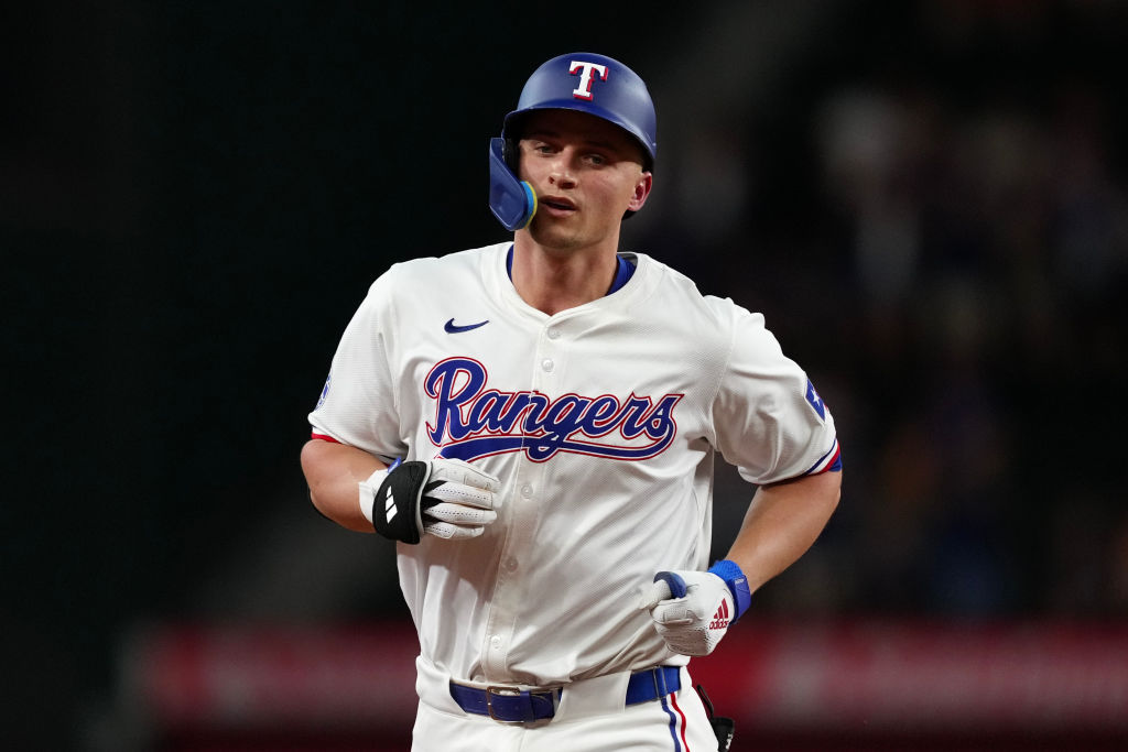 ARLINGTON, TEXAS - AUGUST 19: Corey Seager #5 of the Texas Rangers runs the bases after hitting a solo home run during the first inning against the Pittsburgh Pirates at Globe Life Field on August 19, 2024 in Arlington, Texas